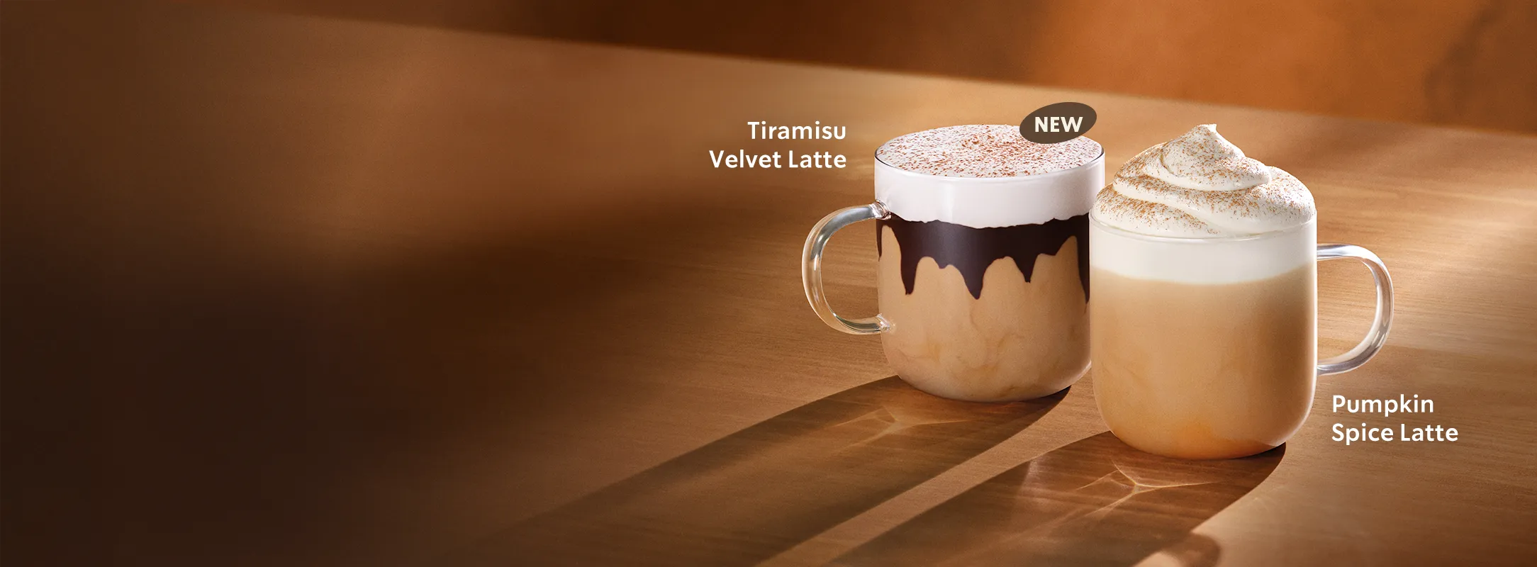 Atmospheric beverage shots of a Pumpkin Spice Latte and a Tiramisu Velvet Latte